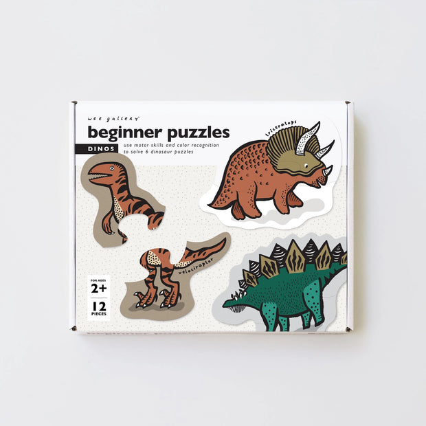 A box of puzzles with illustrated dinosaurs